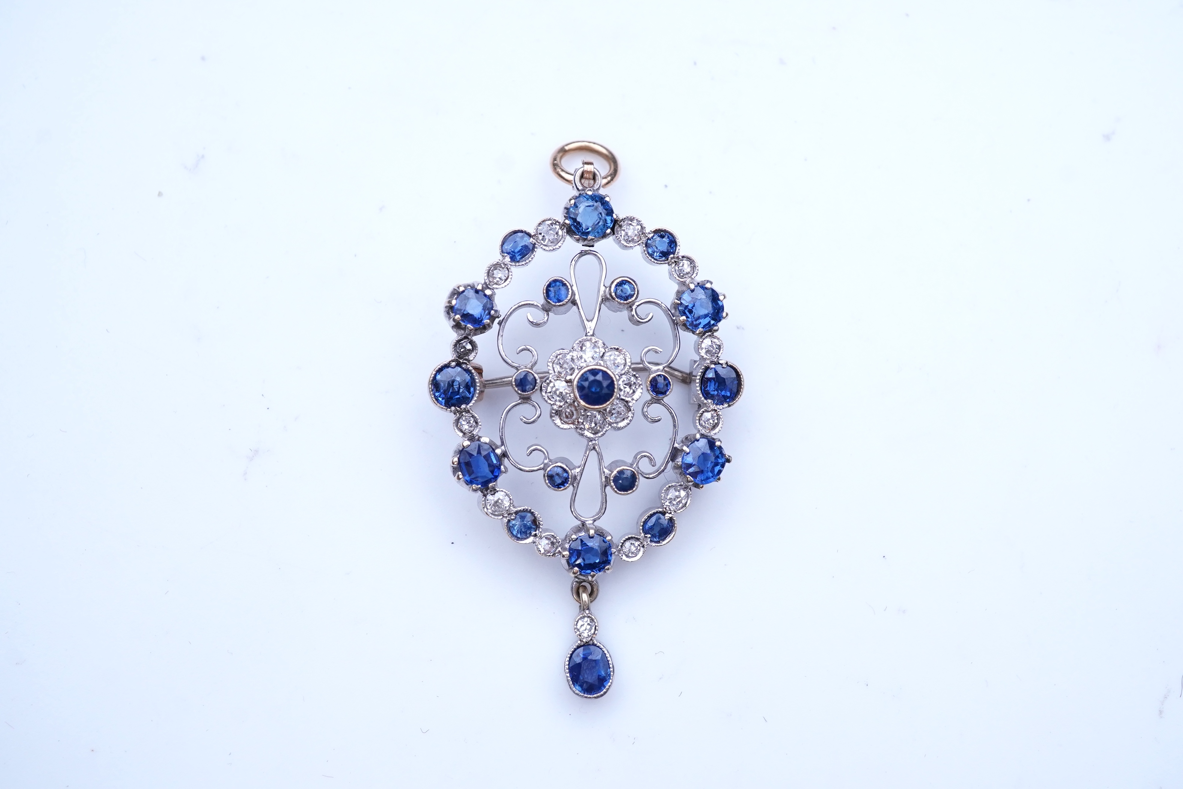 A sapphire and diamond brooch/pendant, mid 20th century